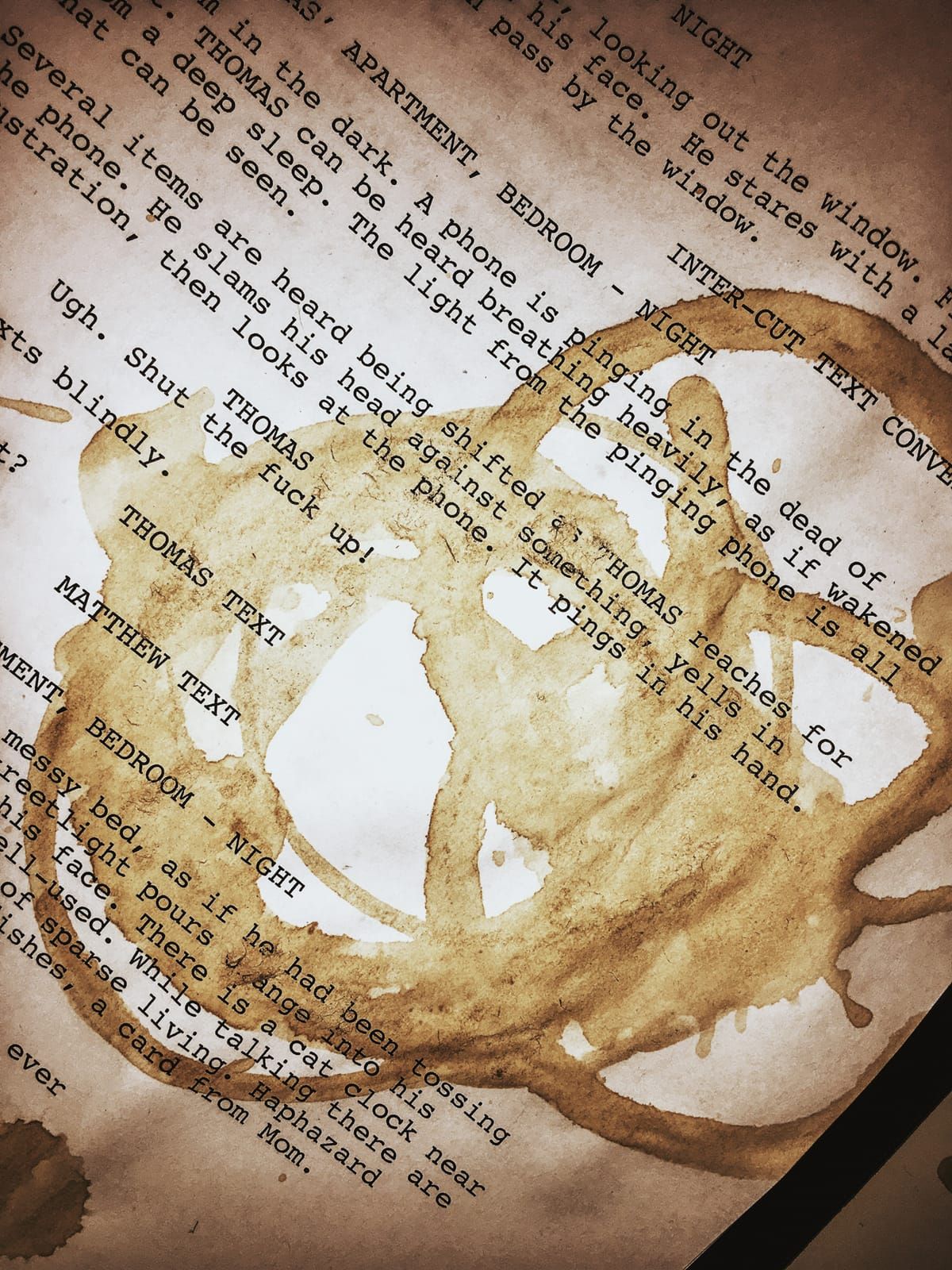 A coffee-stained script page